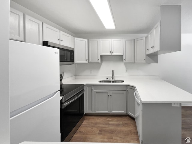 1303 N Riverside Ave Unit 32, Provo, UT 84604 - kitchen featuring a sink, gray cabinets, dark wood finished floors, light countertops, and appliances with stainless steel finishes