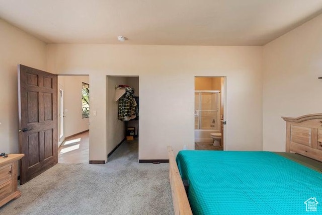 1151 W Shawnee Ct, Ivins, UT 84738 - bedroom featuring baseboards, light carpet, and connected bathroom