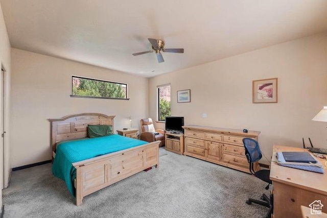 1151 W Shawnee Ct, Ivins, UT 84738 - bedroom with light carpet, a ceiling fan, and multiple windows