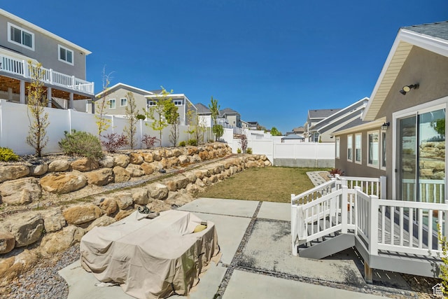7518 S 5720 W, West Jordan, UT 84081 - view of yard featuring a fenced backyard, a patio area, and a residential view