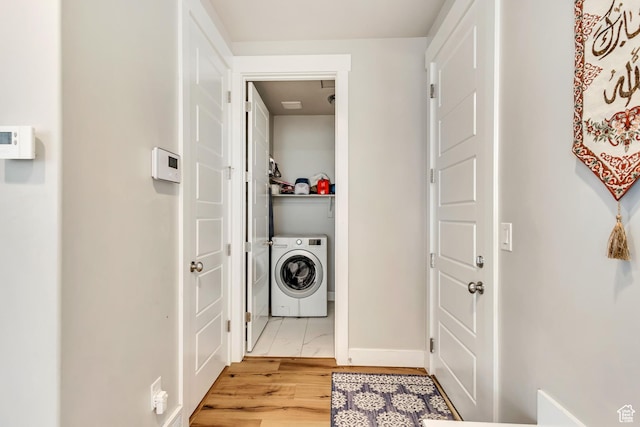 7518 S 5720 W, West Jordan, UT 84081 - washroom with light wood-style floors, baseboards, and washer / clothes dryer