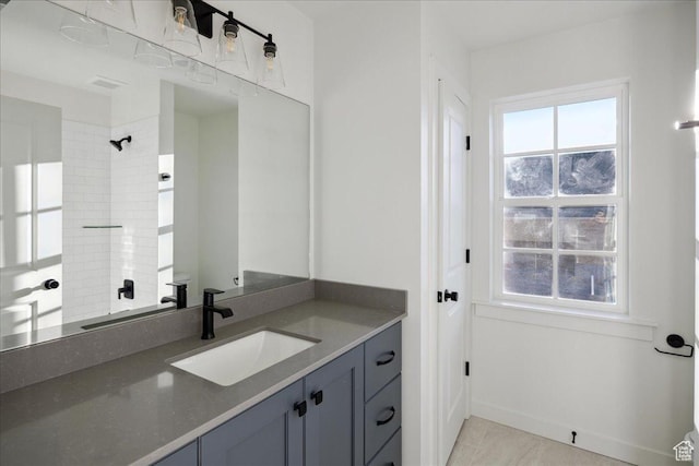 6768 W Docksider Dr Unit 298, South Jordan, UT 84009 - bathroom with vanity, a shower, baseboards, and tile patterned floors