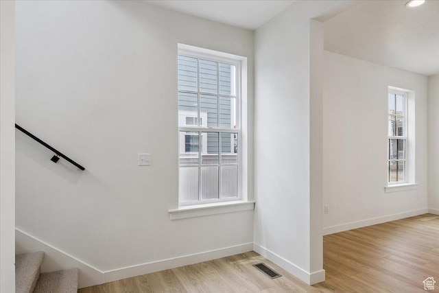 6768 W Docksider Dr Unit 298, South Jordan, UT 84009 - staircase featuring plenty of natural light and wood finished floors
