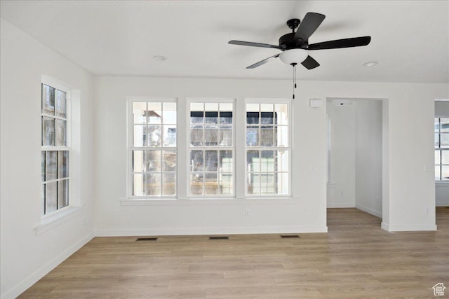 6768 W Docksider Dr Unit 298, South Jordan, UT 84009 - unfurnished room featuring baseboards, healthy amount of natural light, and light wood-style floors