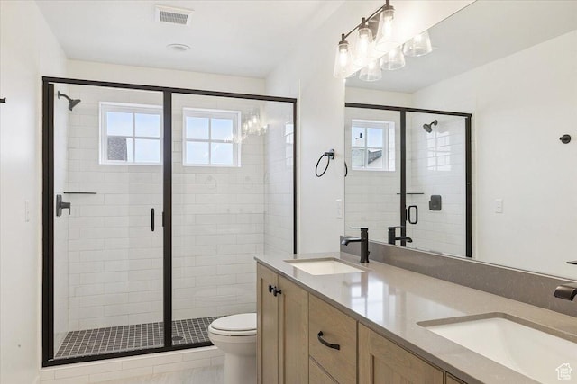 6768 W Docksider Dr Unit 298, South Jordan, UT 84009 - bathroom with double vanity, a shower stall, and a chandelier