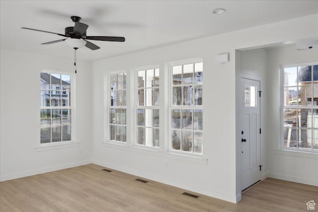 6768 W Docksider Dr Unit 298, South Jordan, UT 84009 - unfurnished dining area with light wood-style flooring, baseboards, and ceiling fan