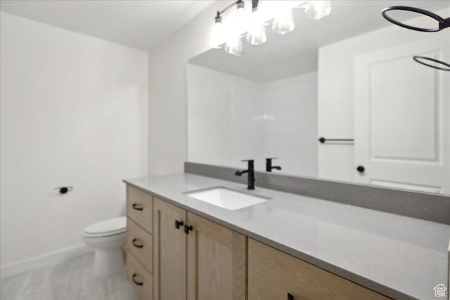 6768 W Docksider Dr Unit 298, South Jordan, UT 84009 - bathroom featuring vanity, toilet, baseboards, and a chandelier