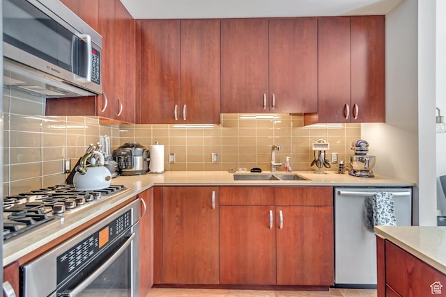35 E 100 S Unit 204, Salt Lake City, UT 84111 - kitchen with backsplash, light countertops, stainless steel appliances, and a sink