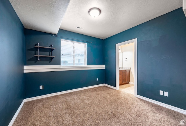 3440 Greenfield Cir, Mountain Green, UT 84050 - unfurnished bedroom featuring a textured ceiling, carpet, baseboards, and visible vents