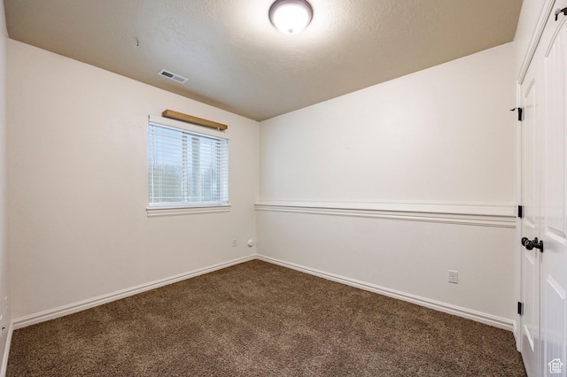 3440 Greenfield Cir, Mountain Green, UT 84050 - unfurnished room with baseboards, carpet flooring, visible vents, and a textured ceiling