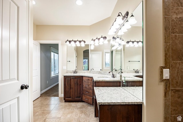 3440 Greenfield Cir, Mountain Green, UT 84050 - bathroom with a sink, double vanity, and tile patterned floors