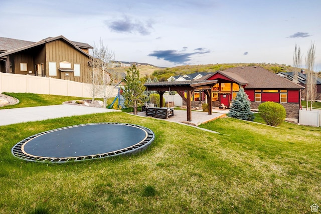 3440 Greenfield Cir, Mountain Green, UT 84050 - view of yard with a gazebo, a trampoline, a patio, a fenced backyard, and an outdoor fire pit