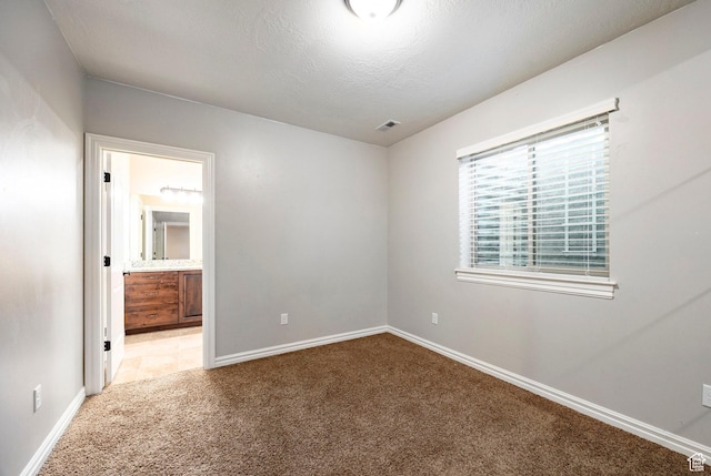 3440 Greenfield Cir, Mountain Green, UT 84050 - unfurnished room featuring baseboards, visible vents, and light colored carpet