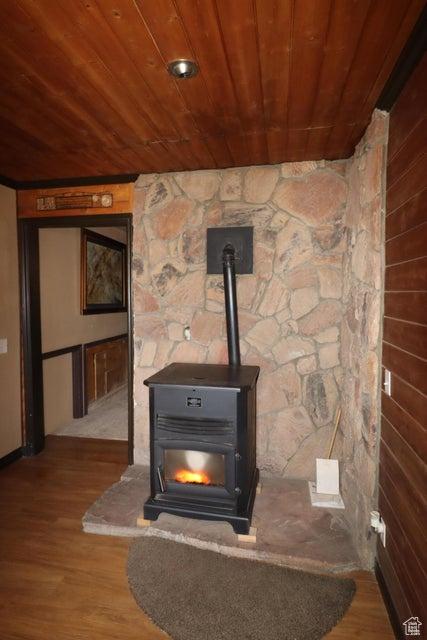 2304 S 11900 W, Cedar City, UT 84720 - interior details featuring a wood stove, wood ceiling, and wood finished floors
