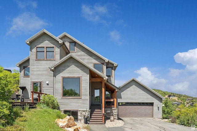 7515 Stagecoach Dr, Park City, UT 84098 - view of front facade featuring a garage and asphalt driveway