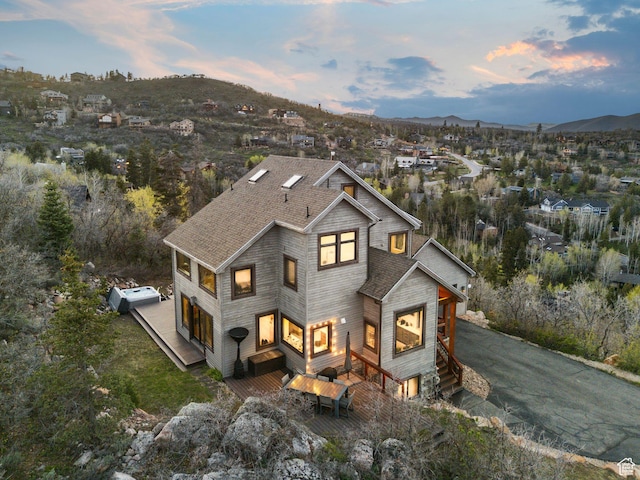 7515 Stagecoach Dr, Park City, UT 84098 - view of front of home featuring a shingled roof, a mountain view, and driveway