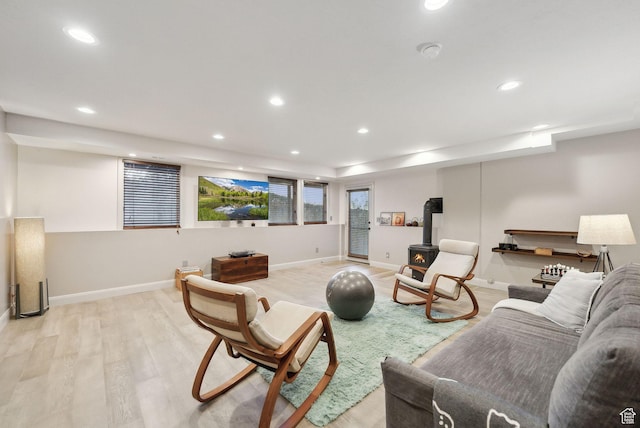 7515 Stagecoach Dr, Park City, UT 84098 - living room with light wood finished floors, recessed lighting, and a wood stove