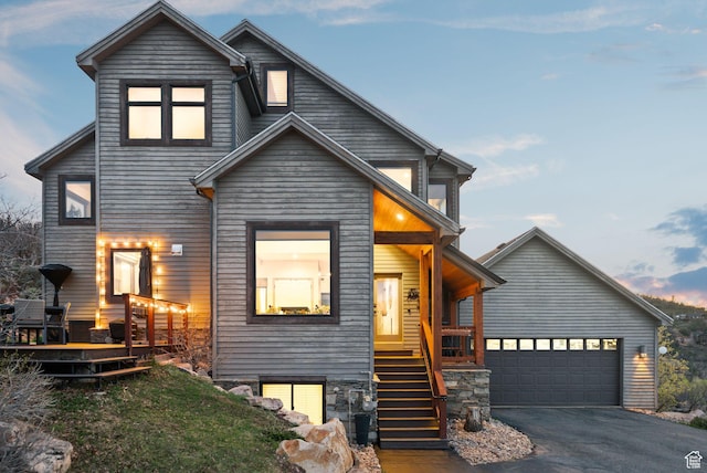7515 Stagecoach Dr, Park City, UT 84098 - contemporary home with a garage, asphalt driveway, covered porch, and stairway