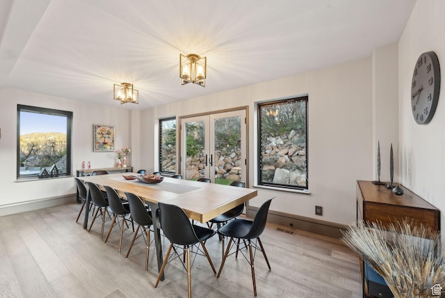 7515 Stagecoach Dr, Park City, UT 84098 - dining area featuring french doors, light wood finished floors, and a chandelier