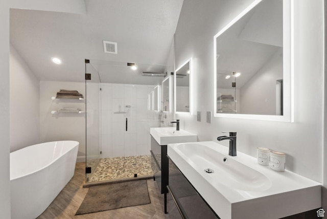 7515 Stagecoach Dr, Park City, UT 84098 - bathroom with a stall shower, a soaking tub, two vanities, and wood finished floors