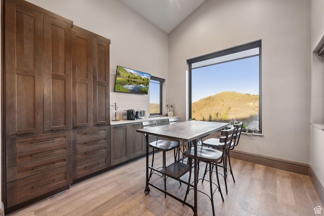 7515 Stagecoach Dr, Park City, UT 84098 - dining room with light wood-style flooring and high vaulted ceiling