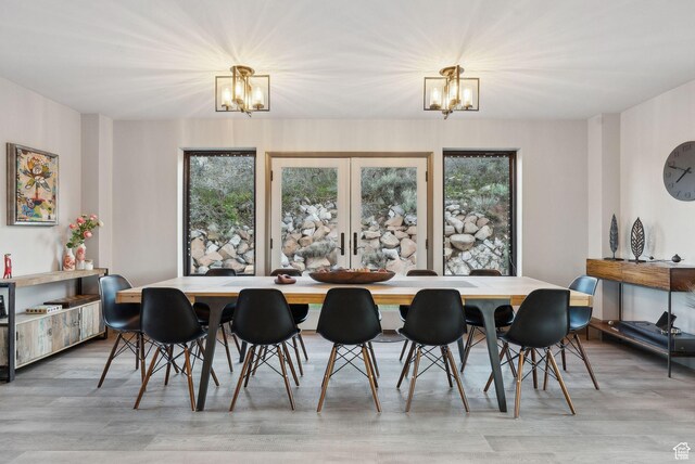 7515 Stagecoach Dr, Park City, UT 84098 - dining room featuring a chandelier and light wood-style floors