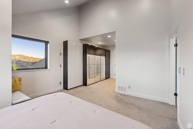 7515 Stagecoach Dr, Park City, UT 84098 - unfurnished bedroom with light colored carpet, a towering ceiling, and recessed lighting