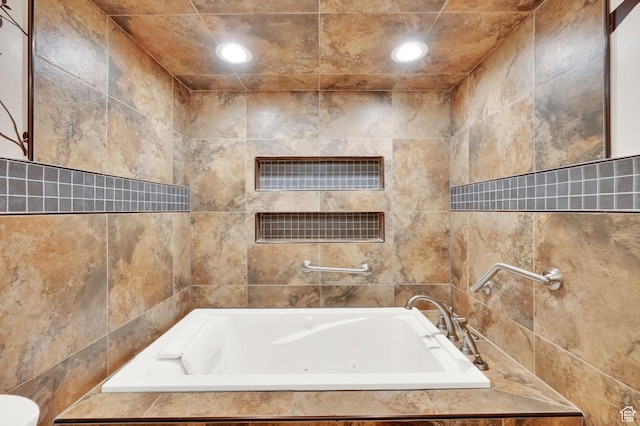 10557 S Pipestone Way S, Jordan, UT 84009 - full bathroom with tile walls, a jetted tub, and recessed lighting