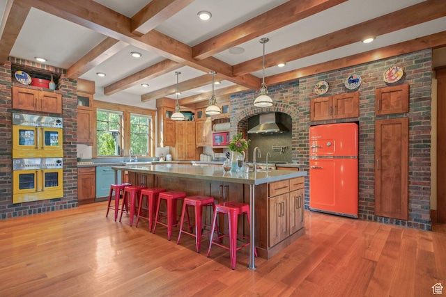 1608 W 1970 N, Provo, UT 84604 - kitchen with fridge, light wood-style flooring, wall chimney range hood, double oven, and dishwasher