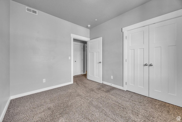 282 W 605 N Unit 307, Centerville, UT 84014 - unfurnished bedroom featuring carpet flooring, a closet, visible vents, and baseboards