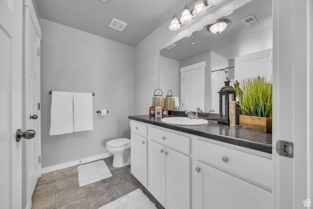 282 W 605 N Unit 307, Centerville, UT 84014 - bathroom featuring baseboards, toilet, vanity, and visible vents