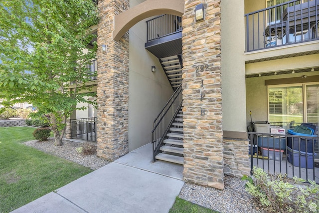 282 W 605 N Unit 307, Centerville, UT 84014 - entrance to property featuring stone siding, stucco siding, and a balcony