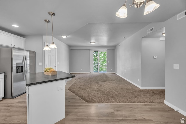 282 W 605 N Unit 307, Centerville, UT 84014 - kitchen with dark countertops, white cabinets, visible vents, and stainless steel refrigerator with ice dispenser