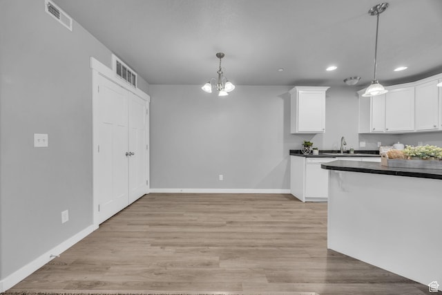282 W 605 N Unit 307, Centerville, UT 84014 - kitchen with white cabinetry, recessed lighting, dark countertops, and visible vents