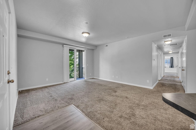 282 W 605 N Unit 307, Centerville, UT 84014 - spare room with a textured ceiling, carpet, baseboards, and visible vents