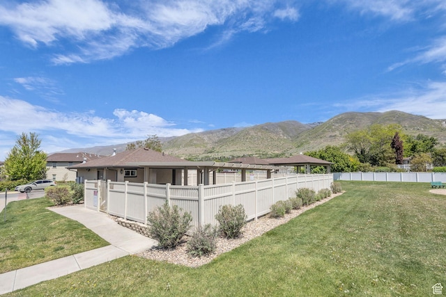 282 W 605 N Unit 307, Centerville, UT 84014 - view of side of property with a mountain view, a yard, fence, and a gazebo