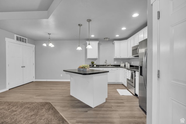 282 W 605 N Unit 307, Centerville, UT 84014 - kitchen featuring a sink, appliances with stainless steel finishes, recessed lighting, white cabinets, and light wood-style floors