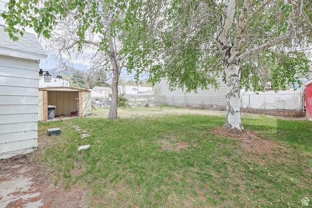 390 E Vine, Tooele, UT 84074 - view of yard featuring an outbuilding, fence, and a shed