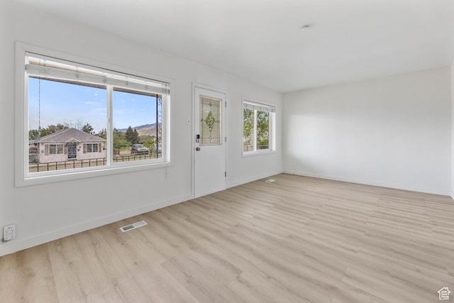 390 E Vine, Tooele, UT 84074 - interior space featuring light wood-type flooring, visible vents, and baseboards