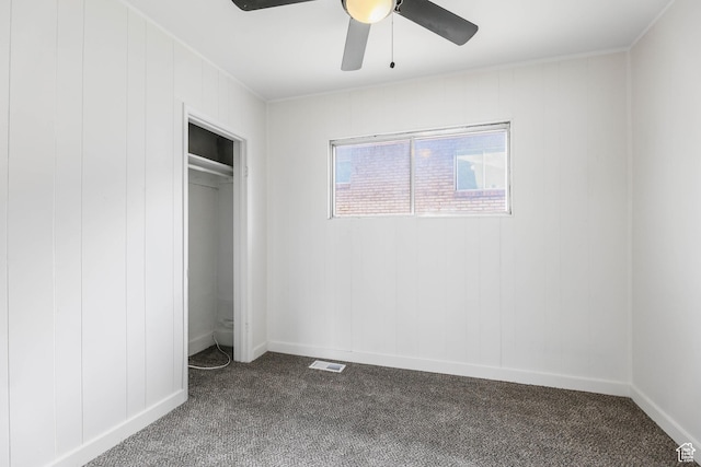 390 E Vine, Tooele, UT 84074 - unfurnished bedroom featuring a ceiling fan, dark carpet, baseboards, and visible vents