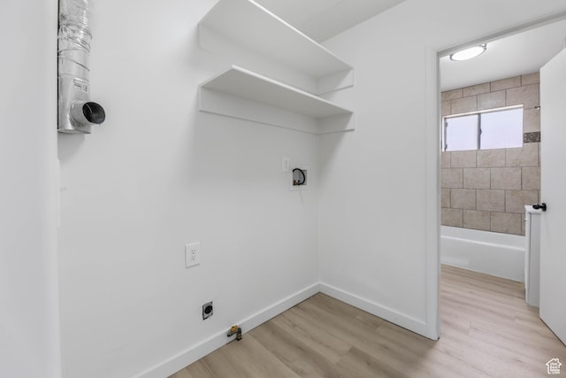 390 E Vine, Tooele, UT 84074 - washroom featuring laundry area, light wood-style flooring, washer hookup, and baseboards