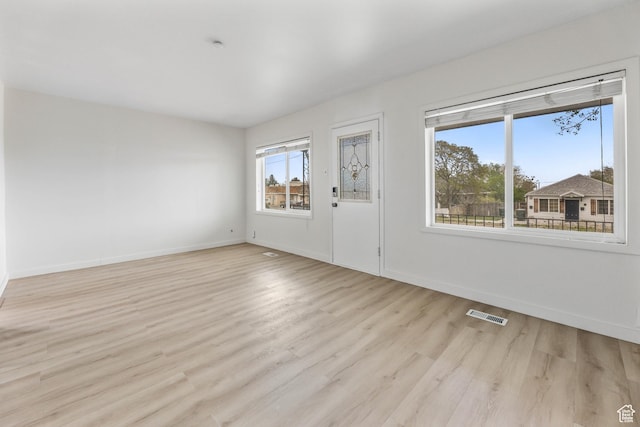 390 E Vine, Tooele, UT 84074 - empty room featuring light wood-type flooring, baseboards, and visible vents