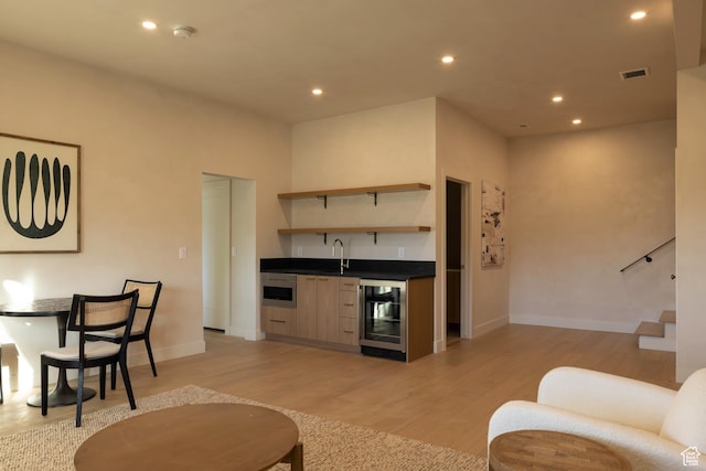 7370 N Buckboard Dr, Park City, UT 84098 - living area with indoor wet bar, light wood-type flooring, visible vents, wine cooler, and recessed lighting