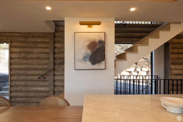 7370 N Buckboard Dr, Park City, UT 84098 - unfurnished dining area with recessed lighting, stairs, and log walls