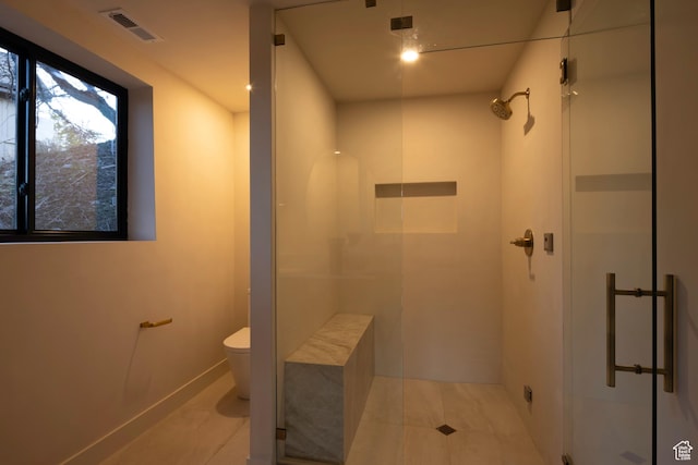 7370 N Buckboard Dr, Park City, UT 84098 - bathroom featuring a stall shower, toilet, visible vents, and tile patterned floors