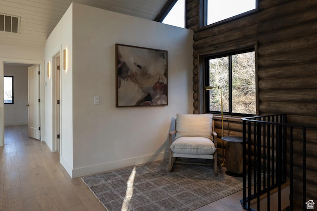 7370 N Buckboard Dr, Park City, UT 84098 - living area featuring baseboards, hardwood / wood-style floors, and log walls