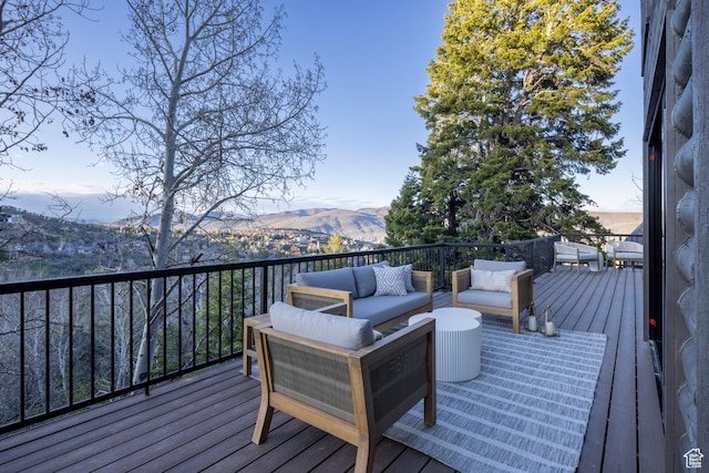 7370 N Buckboard Dr, Park City, UT 84098 - wooden deck with an outdoor living space and a mountain view