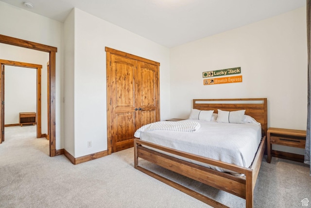 12221 Ross Creek Dr Unit 137, Kamas, UT 84036 - bedroom with light colored carpet, a closet, and baseboards