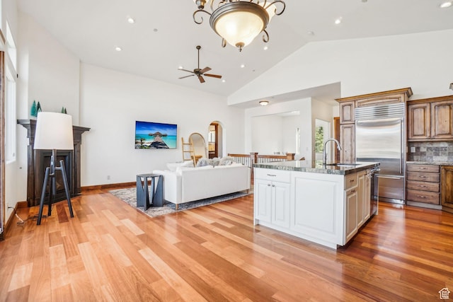 12221 Ross Creek Dr Unit 137, Kamas, UT 84036 - kitchen with built in refrigerator, light wood-style flooring, open floor plan, and a sink