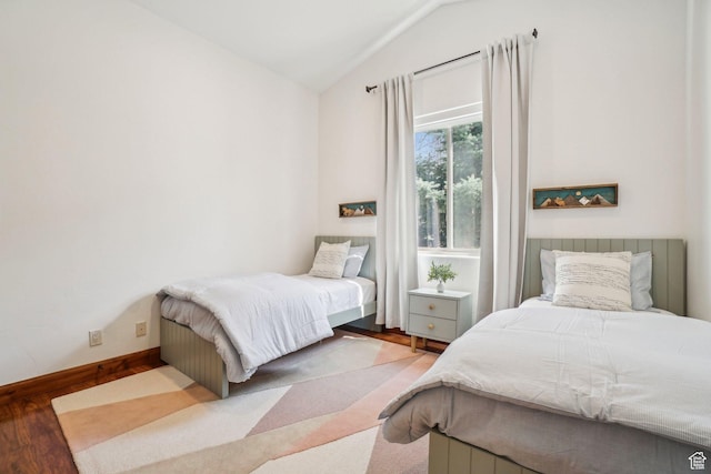 12221 Ross Creek Dr Unit 137, Kamas, UT 84036 - bedroom featuring lofted ceiling, baseboards, and wood finished floors